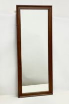 A large 1960’s Mid Century teak framed mirror. 109x43cm