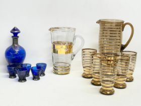 Vintage drinks set. A 6 piece 1970’s gilt smoked glass lemonade drinks set, pitcher measures