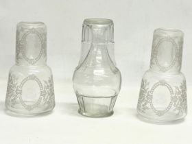 A pair of Victorian etched glass carafe’s and matching cups, with an early 20th century carafe and