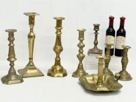 A quantity of Victorian brass candlesticks.