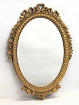 A vintage ornate gilt framed mirror. 61x86cm