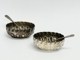 A pair of silver salts and spoons. 49.67 grams.