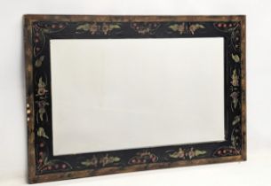 An ornate stencil inlaid mirror. 92x61cm