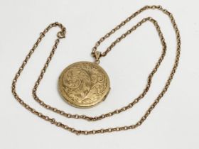 A 9ct gold chain and locket. 32.26 grams.