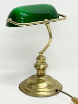 A brass desk lamp with glass shade. 28x37cm