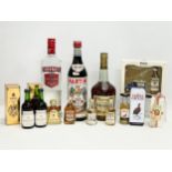 A collection of alcohol. A bottle of Teachers Highland Cream Scotch Whisky Merry Christmas, 5cl. 2