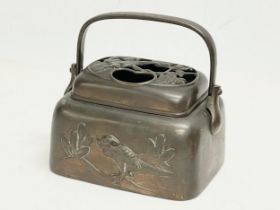 A Japanese Meiji Period late 19th century bronze hand warmer. 20x15x18.5cm including handle.