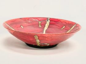 A glazed pottery fruit bowl. 34x9cm