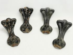 4 Victorian cast iron bath feet.