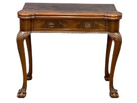 A good quality early 20th century Irish Chippendale Revival mahogany turnover games table with