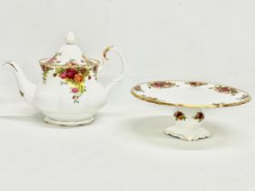 A Royal Albert Old Country Roses teapot and comport cake stand. Teapot 26x19cm.