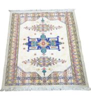 A vintage Middle Eastern style rug. 195x138cm