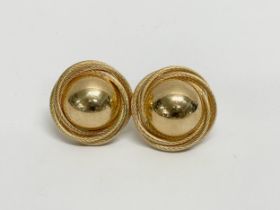 A pair of 9ct gold earrings.