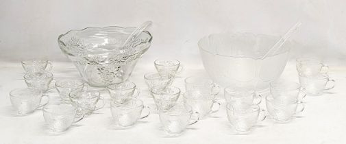 2 vintage punch bowls and cups, with serving spoons. 1 bowl measures 30x14.5cm