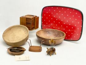 A collection of Mid Century kitchenware. Teak coasters and stand, pig cocktail, double sided tray, 2