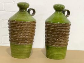 A pair of large Italian glazed terracotta lamps in the form of jugs. 24x45cm