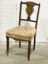 An Edwardian inlaid mahogany side chair.