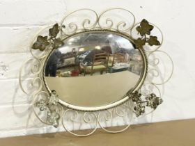 A vintage wrought iron and gilt framed mirror. 47x38cm