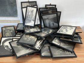 A collection of vintage framed pictures .