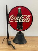 A cast iron Coca Cola wall hanging bell. 33cm