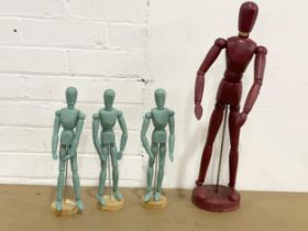 4 wooden tabletop mannequins. Largest 56cm