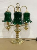 A large brass 3 branch table lamp with glass shades. 44x53cm