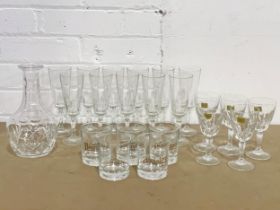 A quantity of vintage crystal drinking glasses.