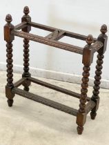 A vintage oak stick stand. 60x24x68cm