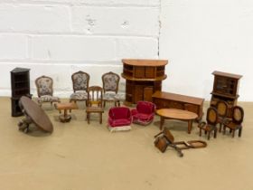 A collection of vintage dolls house furniture.