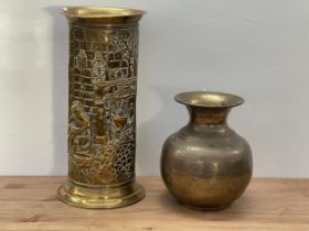 A vintage Indian brass vase and a stick stand.