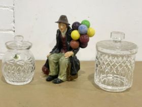 A Royal Doulton ‘Balloon Seller’ and 2 Tyrone Crystal jars with lids.