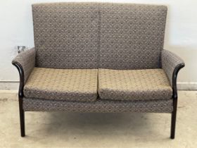 A vintage Parker Knoll 2 seater sofa. Model 749/1014. 121cm