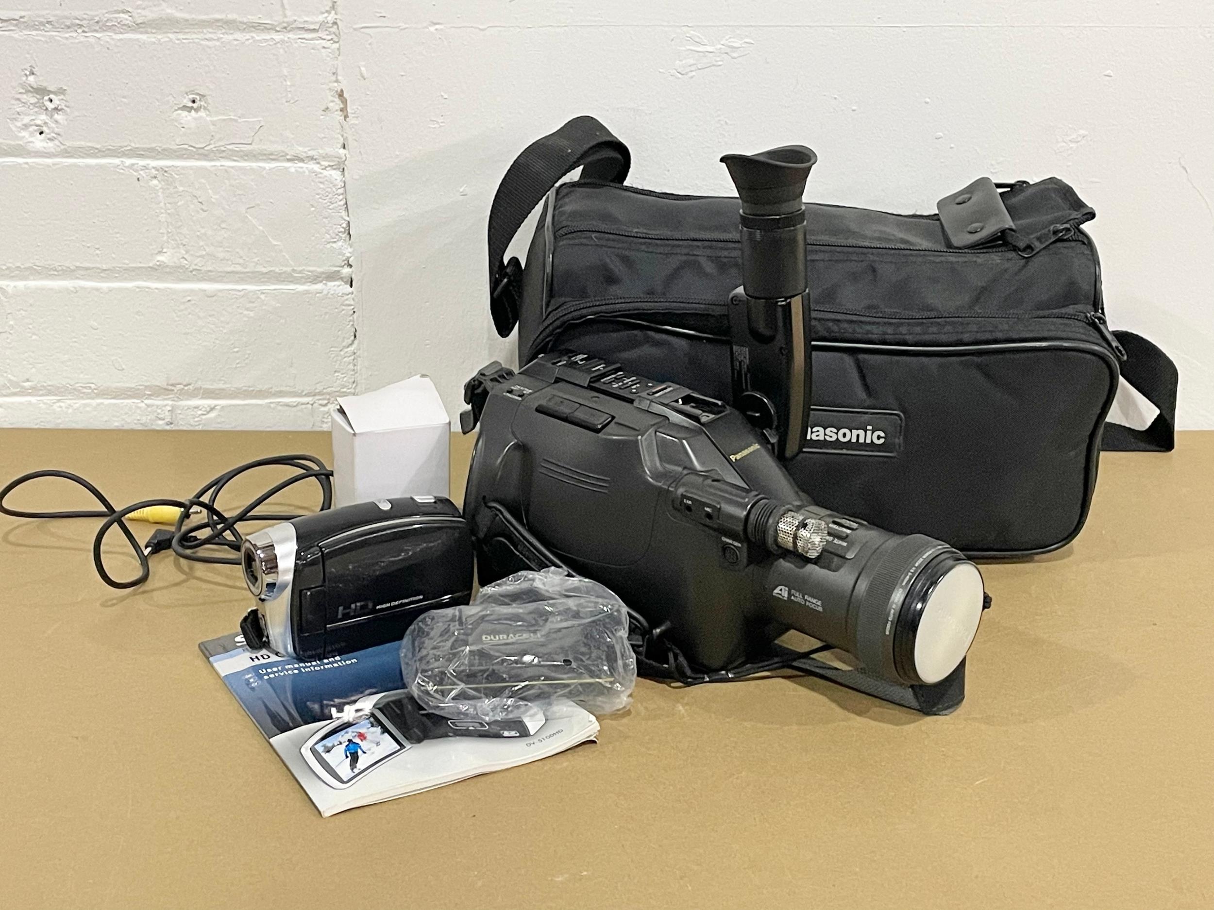 A Panasonic G202 Movie Camera in bag with a Silver Crest Home Tech HD Camcorder.