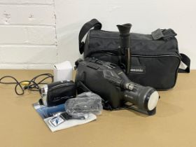 A Panasonic G202 Movie Camera in bag with a Silver Crest Home Tech HD Camcorder.