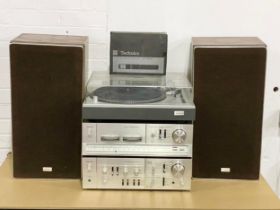 A vintage Toshiba music system. A Toshiba Direct Drive Turntable SR-255 with speakers and Toshiba