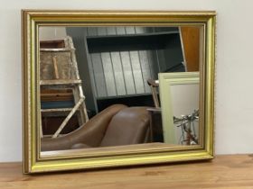 A gilt framed mirror. 65x50cm