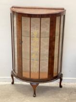 A vintage bow front china cabinet. 72x29x114cm