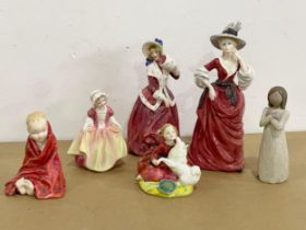 A collection of porcelain figurines. 4 Royal Doulton including Royal Doulton ‘Christmas Morn’