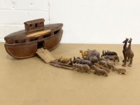 A wooden Noah’s Ark and animals. Ark measures 34x17cm