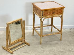 2 pieces of Mid Century. A Mid Century wicker and cane end table with drawer and glass top. A bamboo