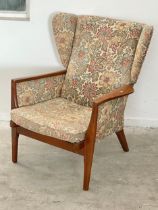 A vintage Parker Knoll wingback armchair. Model 973/4-993/4.