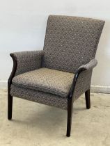 A vintage Parker Knoll armchair. Model 749/1014.
