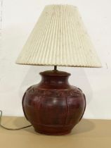 A large terracotta table lamp. 30x59cm
