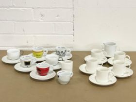 A collection of designer coffee cups and saucers. 11 piece Maxwell Williams coffee set, with a