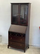 A Stag bureau bookcase. 79x45x183cm