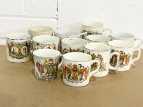 A collection of early 20th century Coronation mugs.