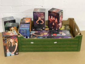 A collection of Buffy the Vampire Slayer VHS tapes.