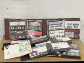 A large collection of First Day Covers and stamps etc.