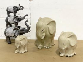 4 elephant ornaments. Largest 29cm
