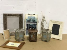 A sundry lot. Frames, candleholders, wine bottle holder, large figurine etc.
